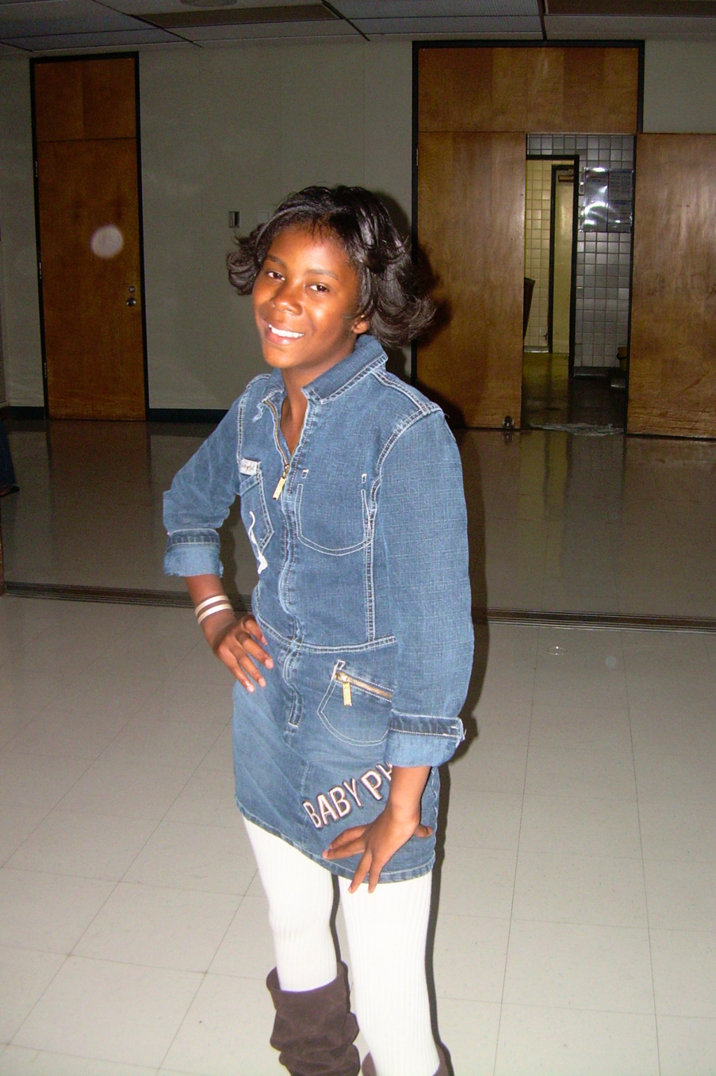Maiya Cunningham smiling in a denim dress.
